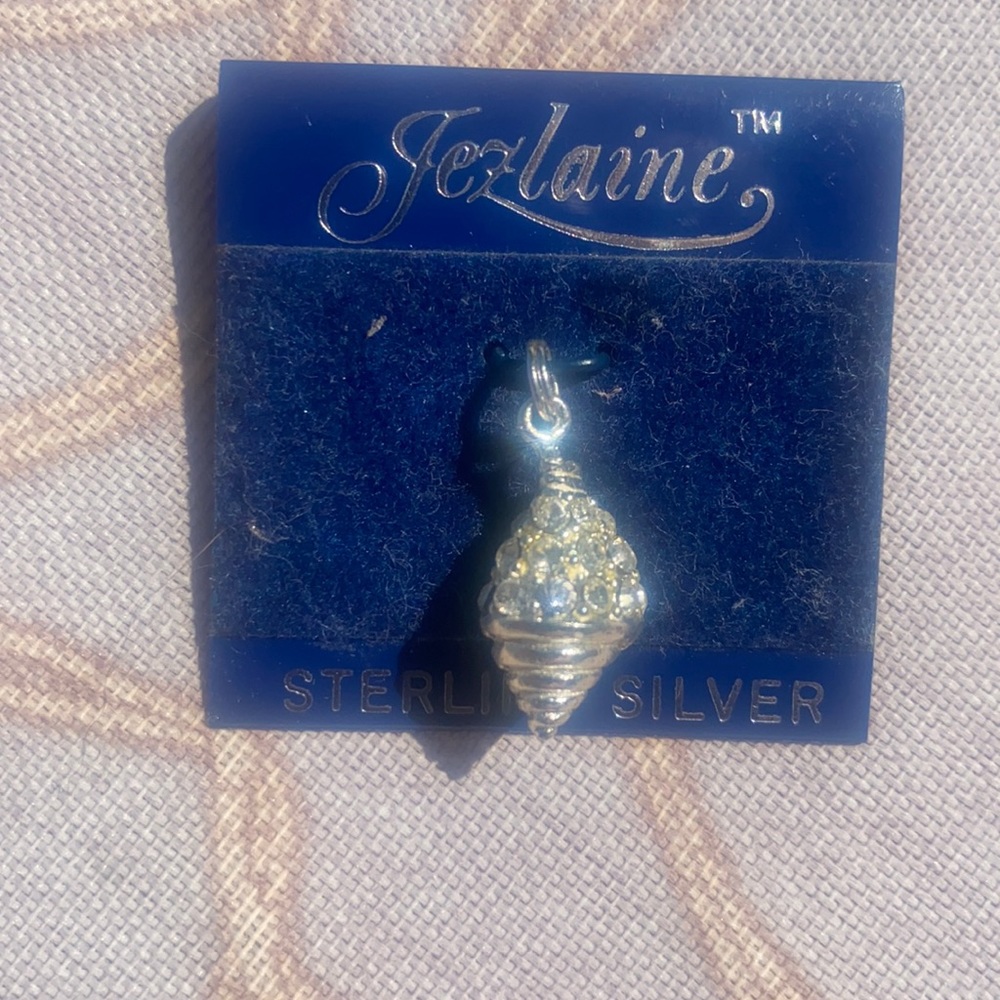 New never worn seashell pendant. Sterling